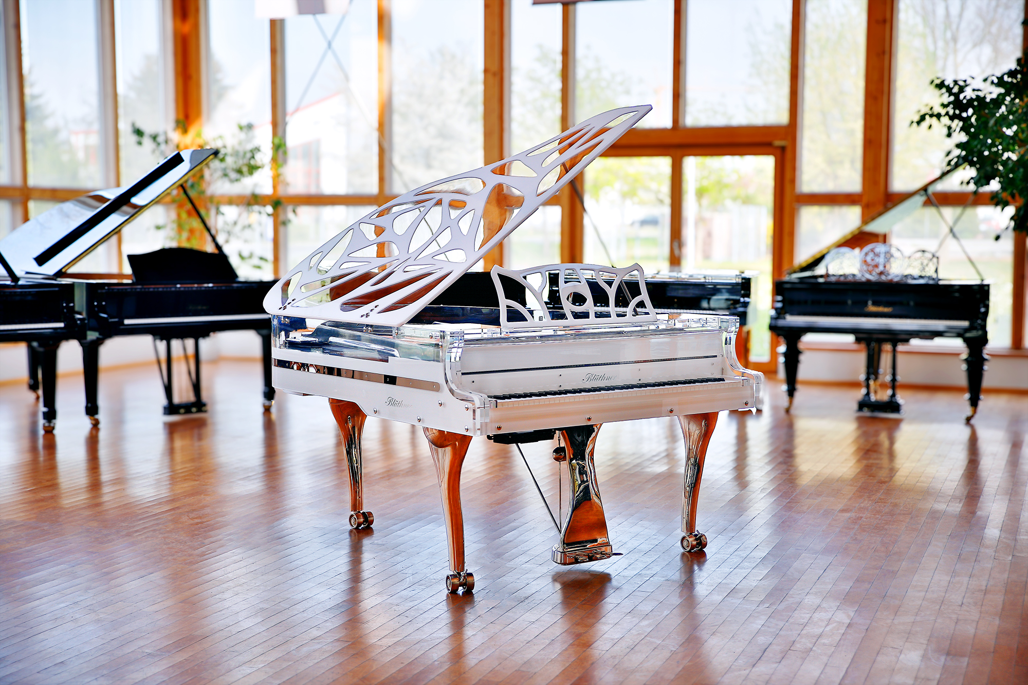 White Blüthner Crystal Hive Elegance Grand Piano with a titanium coloured iron frame